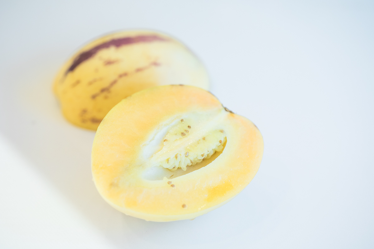 cut open pepino melon showing the inside.