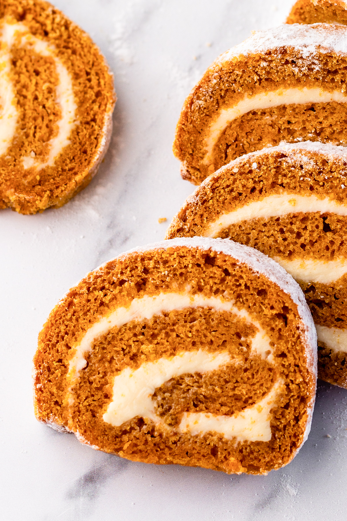 close up of pumpkin roll recipe cooked and sliced